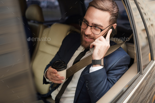 Businessman travelling by car