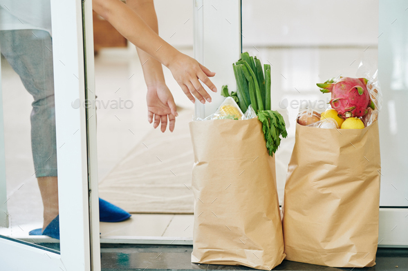 Woman taking order of groceries