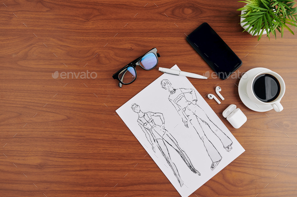 Fashion drawings on table