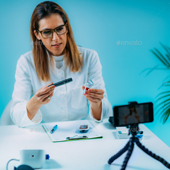 Telehealth – Medical doctor recording video instructions for patient - Stock Photo - Images