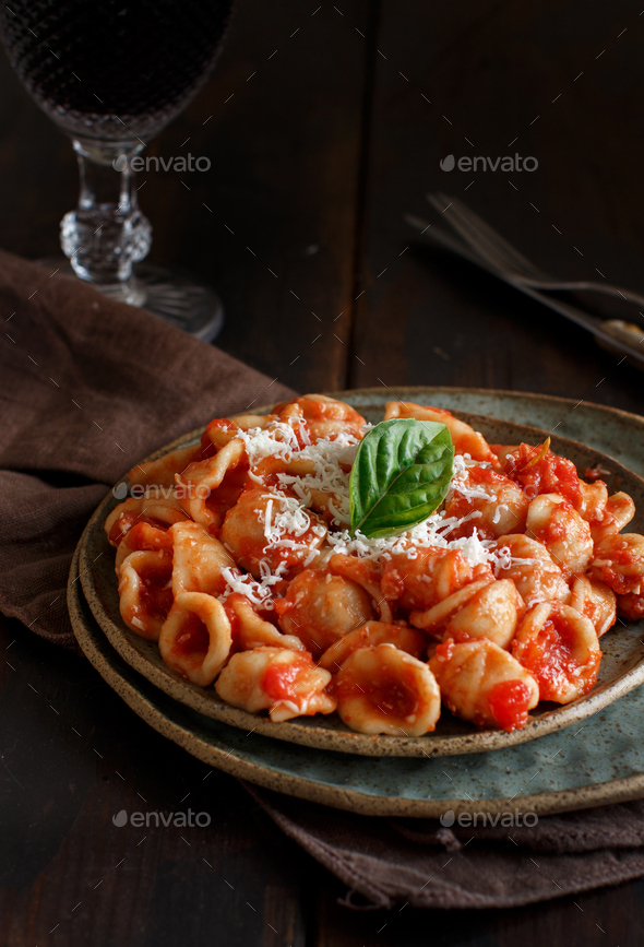 South italian pasta orecchiette with tomato sauce and cacioricotta cheese - Stock Photo - Images