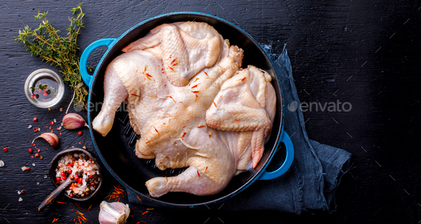 Whole Raw Chicken with Herbs and Spices .Food Ingredient Cooking Background - Stock Photo - Images
