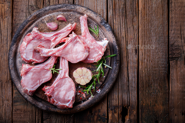 Meat Raw Fresh Mutton on the bone Spices garlic and Rosemary. Food Concept - Stock Photo - Images