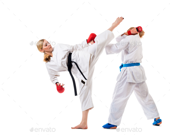 Cute blonde girls training karate on white - Stock Photo - Images