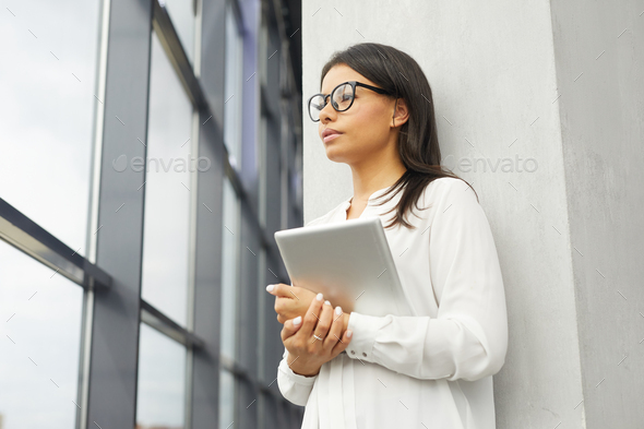 Businesswoman with tablet pc at office - Stock Photo - Images