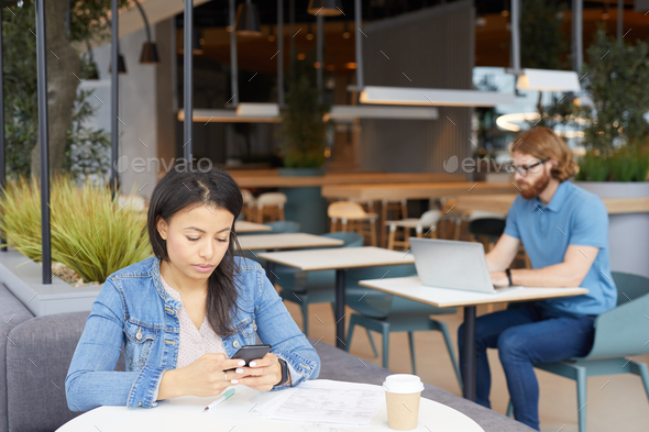 People working with gadgets in cafe - Stock Photo - Images