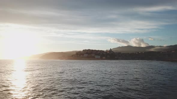 Sunset in Imperia Porto Maurizio aerial view of the coast at sunset in Liguria, Mediterranean sea. alt