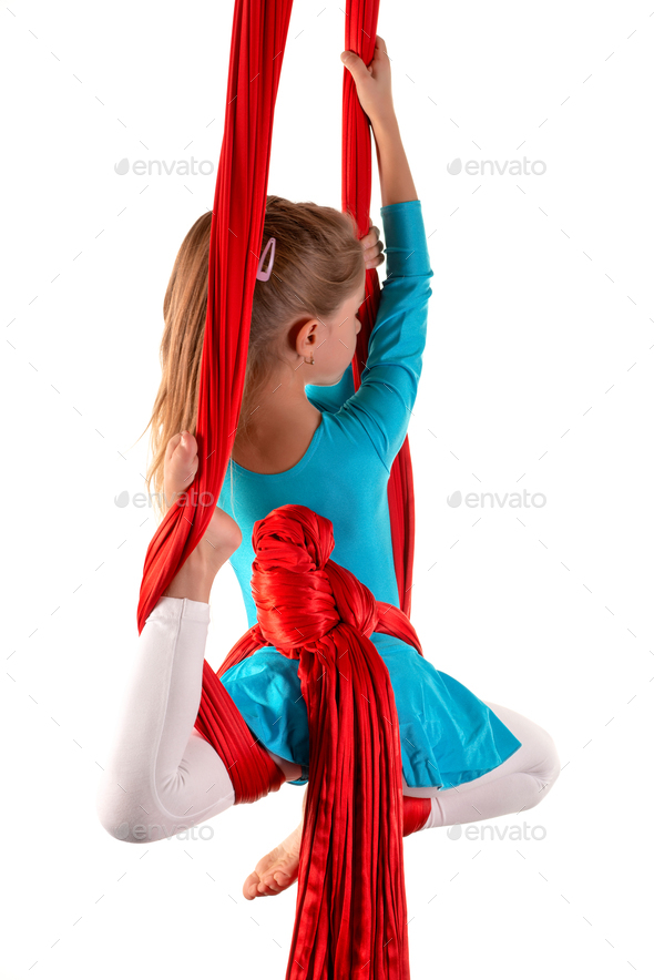 Pretty little girl in a blue gymnastic suit - Stock Photo - Images