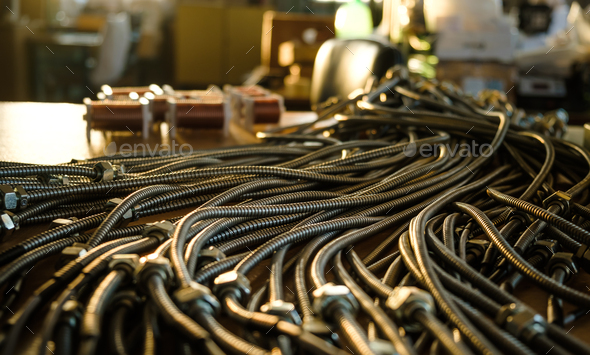 Huge bunch of metal flexible shield tubes with nuts - Stock Photo - Images