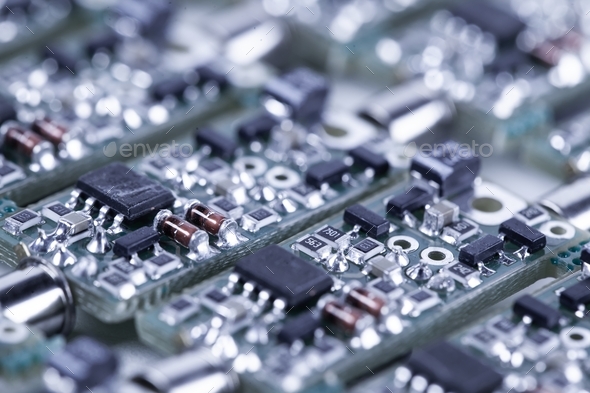 Closeup small microcircuits lie next to each other - Stock Photo - Images