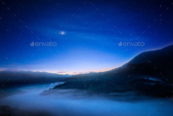 Fantastic night sky over mountains - Stock Photo - Images