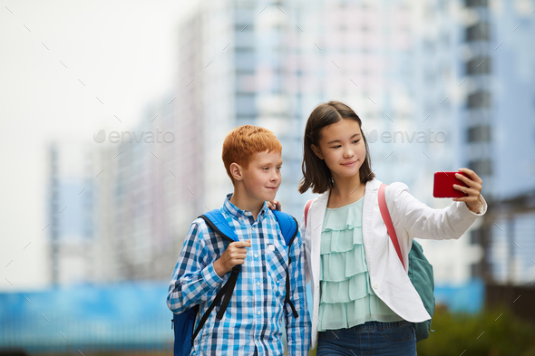 Two friends making selfie portrait - Stock Photo - Images