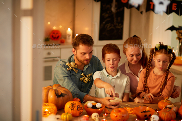 Family celebrating Halloween holiday - Stock Photo - Images