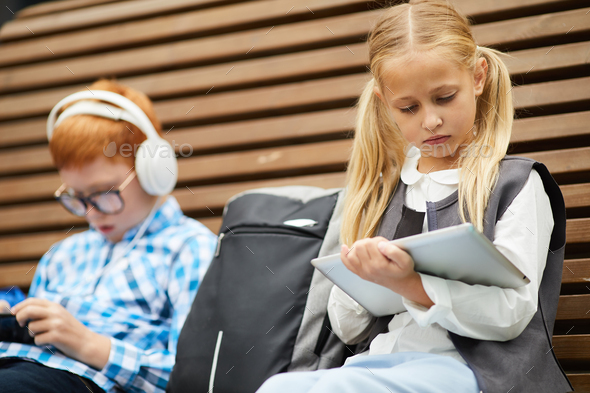 Schoolgirl studying with tablet pc - Stock Photo - Images