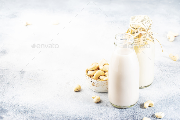 Vegan Cashew nut milk in bottles - Stock Photo - Images
