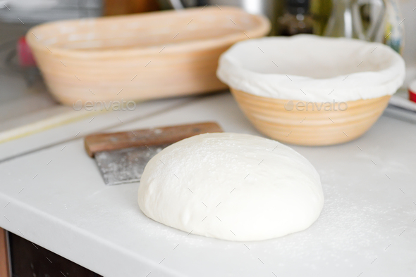 Homemade freshly prepared dough for fresh healthy bakery and pastry on a white kitchen table - Stock Photo - Images