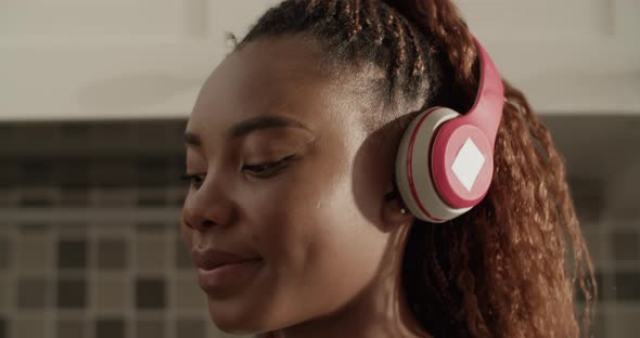 Black Housewife Listening to Music alt