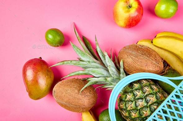 Grocery shopping bag with organic exotic fruits on pink background. - Stock Photo - Images