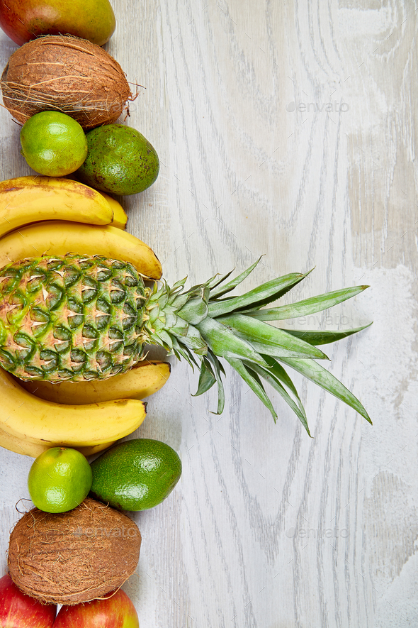 Flat lay of exotic fruits on white background. - Stock Photo - Images