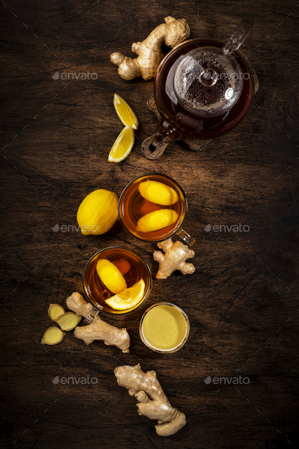 Healing black herbal tea with ginger, honey, lemon - Stock Photo - Images