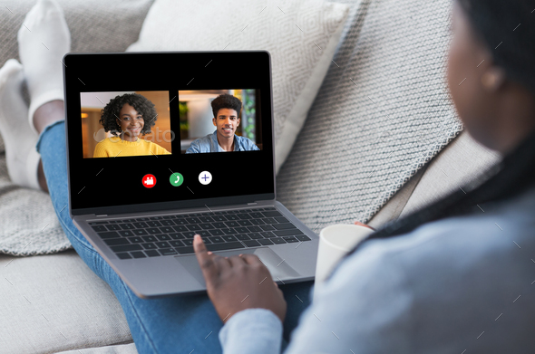Black Woman Having Online Video Call On Laptop With Friends - Stock Photo - Images