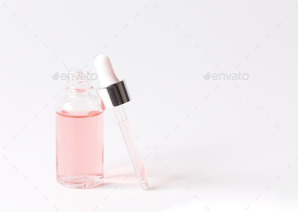 Dropper Bottle with a pipette and pink water.Organic SPA cosmetics .Mock-Up. - Stock Photo - Images