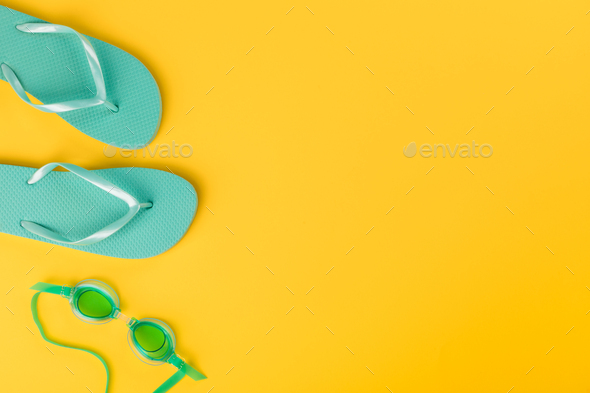 Beach accessories on yellow background.Summer vacation concept.Travel mood to the sea.