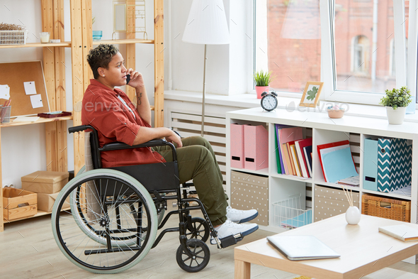 Disabled woman talking on the phone - Stock Photo - Images