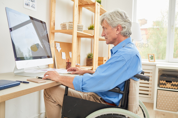 Disabled businessman working on computer