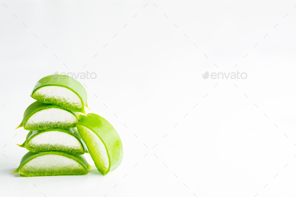 Close-up natural organic aloe vera plant sliced for homemade cosmetic liquid against white - Stock Photo - Images