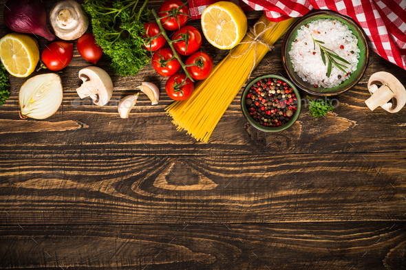 Food cooking background on wooden kitchen table Stock Photo by Nadianb