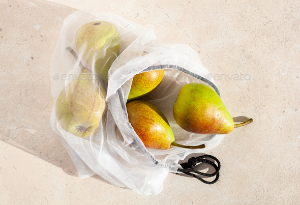 pears fruits in reusable mesh nylon bag, plastic free zero waste concept