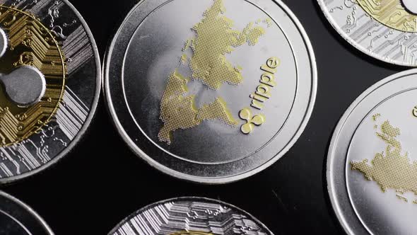 Rotating shot of Bitcoins (digital cryptocurrency) - RIPPLE alt