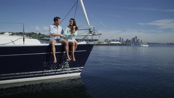 Young couple on sailboat together. Shot on RED EPIC for high quality 4K, UHD, Ultra HD resolution. alt