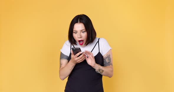 Amazed shocked woman using smart phone checking good news, surprise big win game app. alt