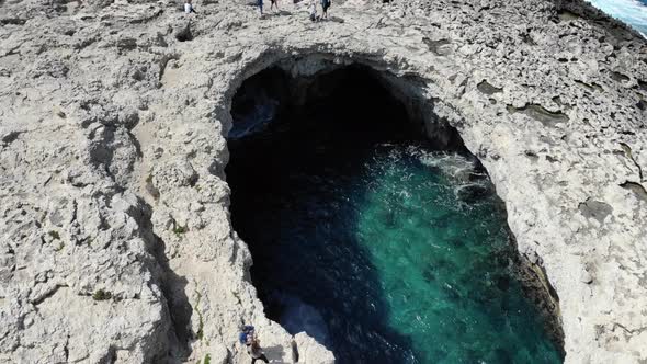 Aerial top view of Coral Lagoon in Armier Bay in Mellieha, Malta towards Comino Island alt