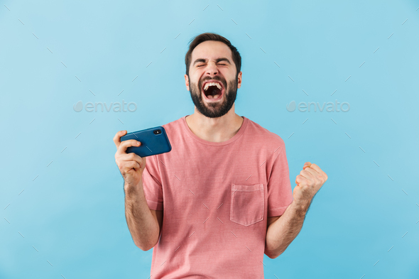 Happy man isolated over blue wall background - Stock Photo - Images