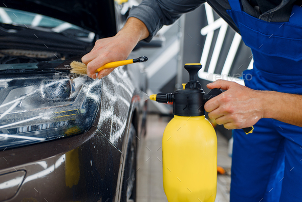 Male hand with spray, car window tint installation Stock Photo by NomadSoul1