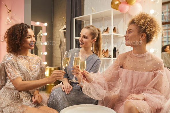 Glamorous Women Drinking Champagne in Dressing Room