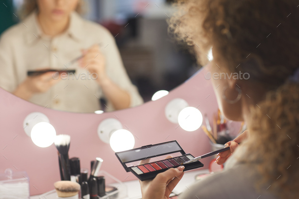 Young Woman Applying Makeup Close Up - Stock Photo - Images