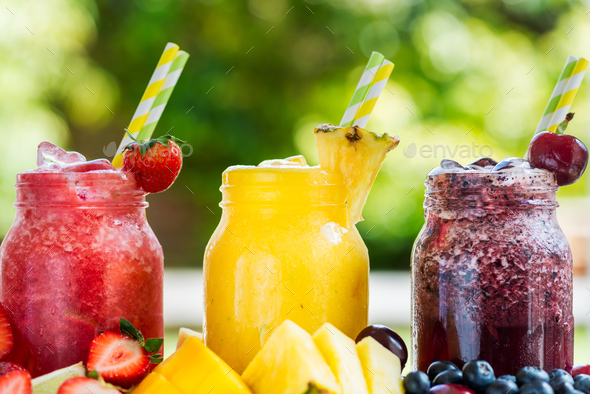 3 delicious slushies from different berries and fruits - Stock Photo - Images