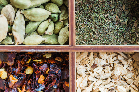 ginger, mint, clove, chili flakes, cardamon, star anise, cinnamo - Stock Photo - Images