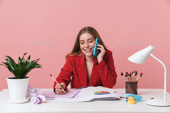 Woman sit at the table talking by mobile phone. - Stock Photo - Images