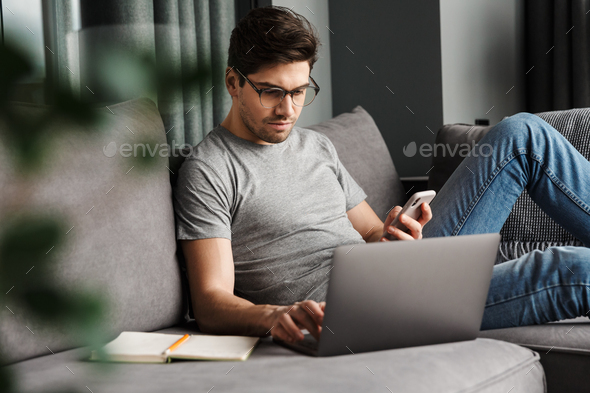 Portrait of an attractive young bearded man - Stock Photo - Images