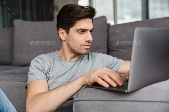 Portrait of an attractive young bearded man - Stock Photo - Images