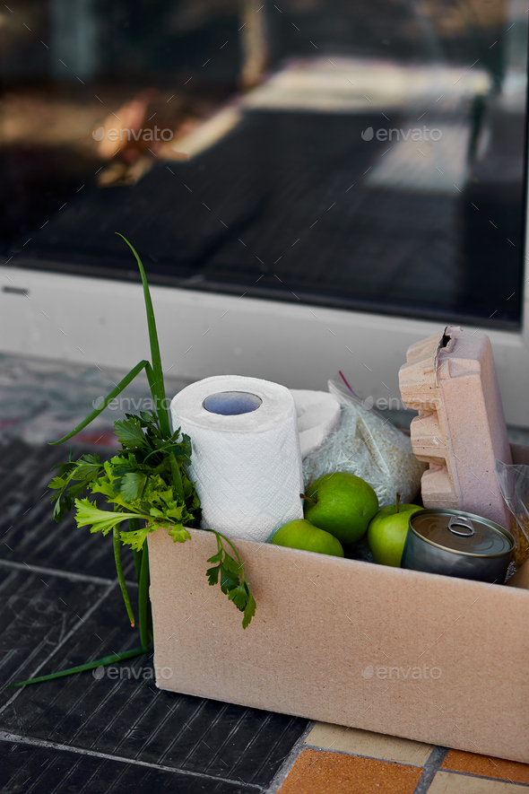 Delivery during the quarantine. Box with Merchandise, goods and food at door of home - Stock Photo - Images
