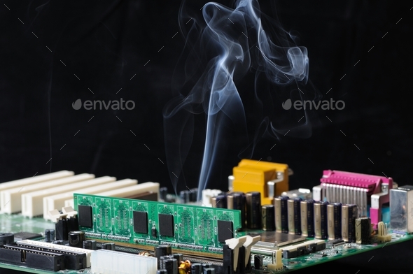 Thin stream of smoke is emitted from microcircuit - Stock Photo - Images