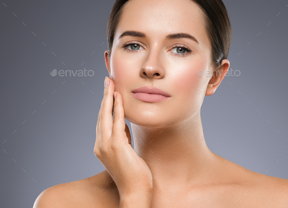 Beauty skin woman face healthy skin beautiful model close up face natural makeup brunette hair over - Stock Photo - Images