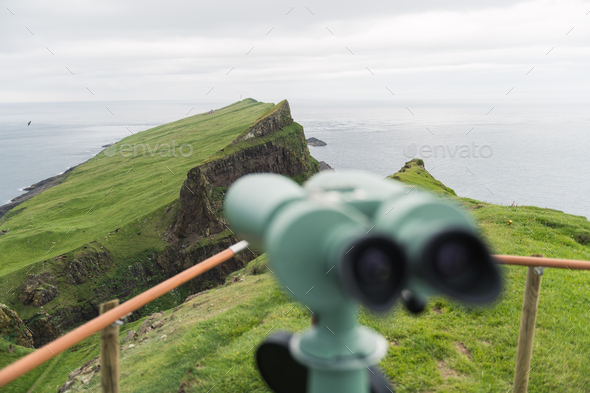 Foggy view of old lighthouse on the Mykines island - Stock Photo - Images