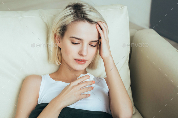 Woman sick in bed. Female portrait ill in bedroom
